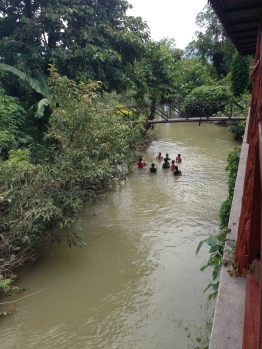 Kids playing in the river outside our cabin in Vang Vieng